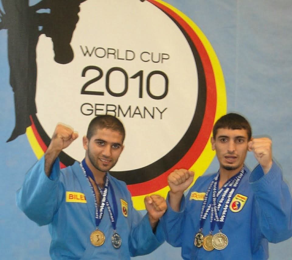 Redouane and teammate Bilel, fists raised with their World Cup 2010 medals