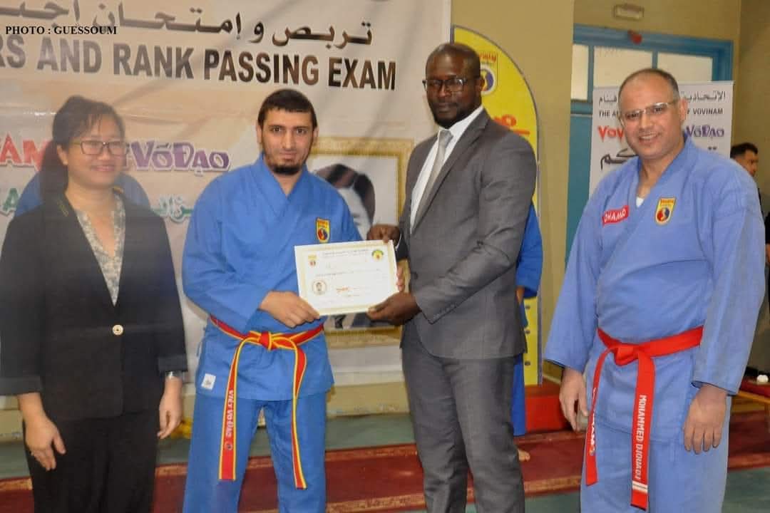 Certificate handover at rank-passing exam ceremony